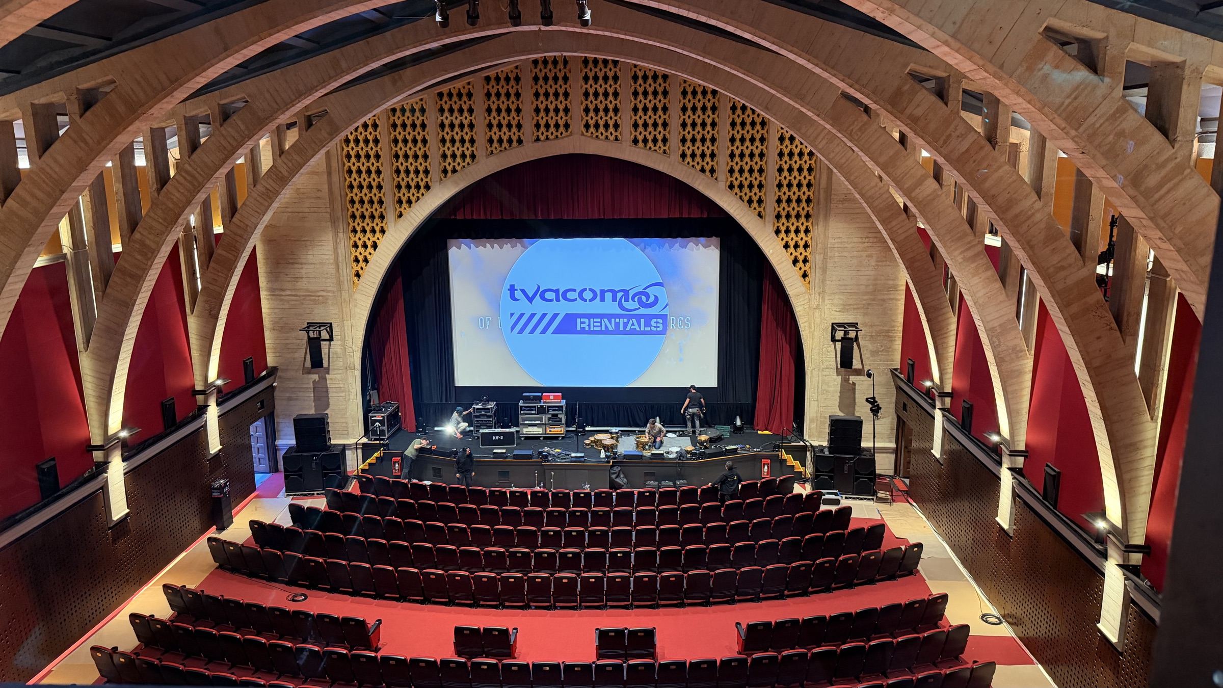 Historic venue during load-in with tvacom on screen